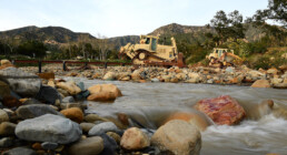 Soldiers from the California Army National Guard’s 649th Engineer Company work to reroute water flow from the San Ysidro Creek inside the Randall Road Debris Basin, Jan. 12, 2023, in Montecito, California, as part of the state’s storm response. The basin is in the same area where a deadly mudflow hit the town five years ago this week. The engineers are supporting the Santa Barbara County Office of Emergency Management through the California Governor's Office of Emergency Services. (U.S. Air National Guard photo by Staff Sgt. Crystal Housman)
